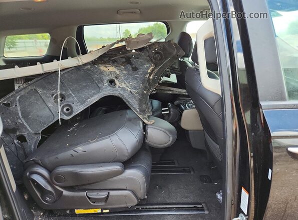 KNDNB5K34T6586191 2026 KIA CARNIVAL Black Vista interior trasera