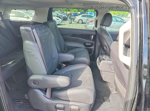 KNDNE5KA5S6030475 2025 KIA CARNIVAL Black Rear interior view