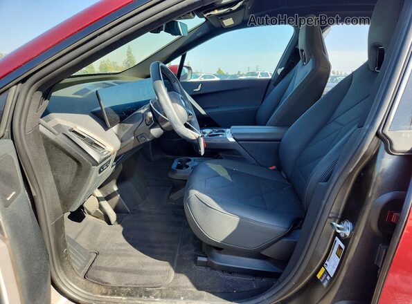 WB523CF03SCS07827 2025 BMW IX Burgundy Вид салону спереду