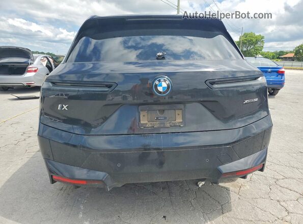 WB523CF05RCR52749 2024 BMW IX Black Rear view