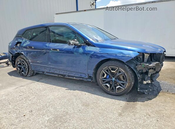 WB523CF06RCR08663 2024 BMW IX Синий Передняя правая четверть