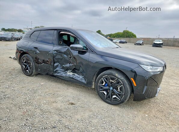 WB523CF0XRCP95512 2024 BMW IX Черный Передняя правая четверть