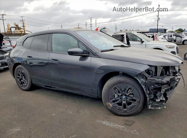 WB543CF06TCW50483 2026 BMW IX Black Передня права чверть