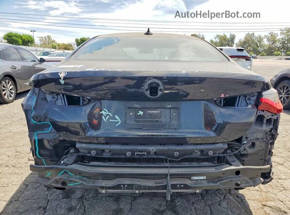 WBA13AR04MCF72259 2021 BMW M4 Black Vista trasera
