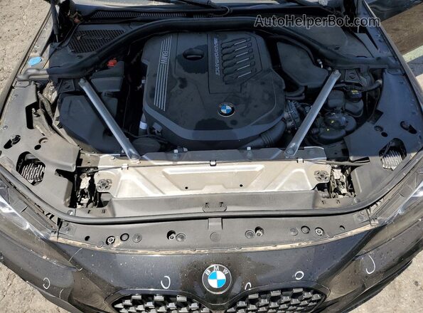 WBA13AR04MCF72259 2021 BMW M4 Black Vista interior trasera