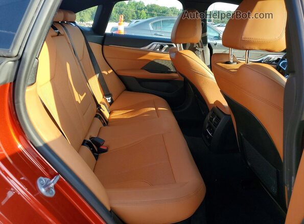 WBA13AW02RFR42762 2024 BMW M4 Orange Вид задніх сидінь