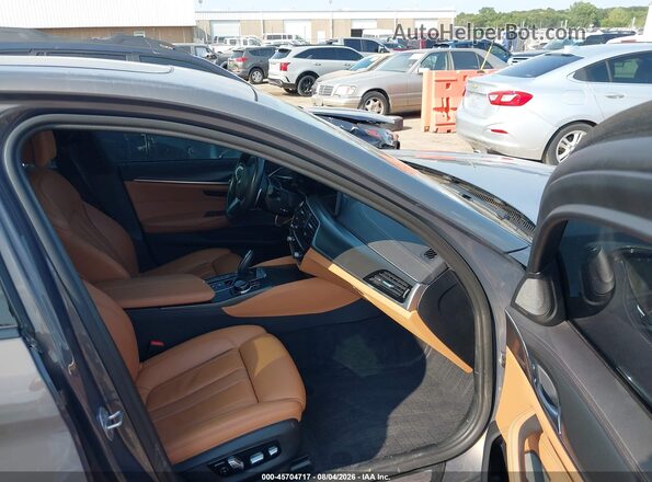 WBA13BK08NCJ40224 2022 BMW M5 Brown Front interior view