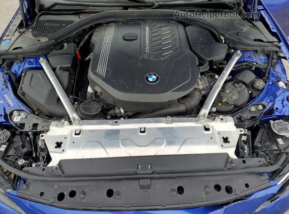 WBA53AT08RCN05310 2024 BMW M4 Blue Vista interior trasera