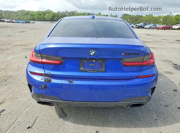 WBA5U7C02LFH56395 2020 BMW M3 Blue Rear view