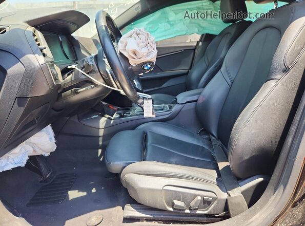 WBA73AK04L7F68093 2020 BMW 2 SERIES Black Front interior view