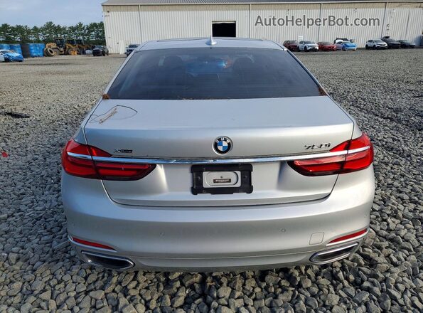 WBA7F2C56GG416813 2016 BMW 7 SERIES Silver Вид ззаду