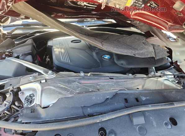WBA83AP02NCH72317 2022 BMW M4 Burgundy Vista interior trasera