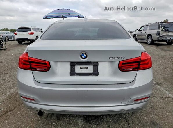 WBA8A9C50JAD27697 2018 BMW 3 SERIES Silver Вид ззаду