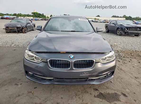 WBA8E1C52JA178602 2018 BMW 3 SERIES Черный Вид спереди