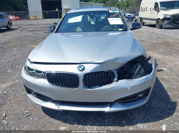 WBA8Z9C52JG827881 2018 BMW 3 SERIES Silver წინა ხედი