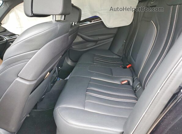 WBAJS7C03LCE14573 2020 BMW M5 Blue Vista de los asientos traseros