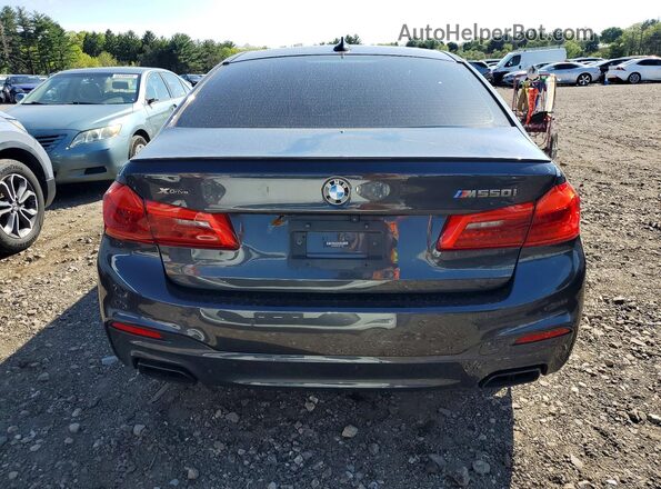 WBAJS7C05LCD94763 2020 BMW M5 Gray Widok z tyłu
