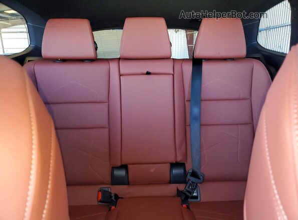 WBX73EF01T5621185 2026 BMW X1 White Rear seats view