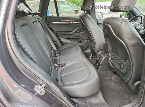 WBXHT3C30G5E50798 2016 BMW X1 Gray Rear interior view