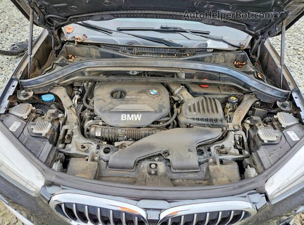 WBXHT3C30G5E50798 2016 BMW X1 Gray Engine compartment view