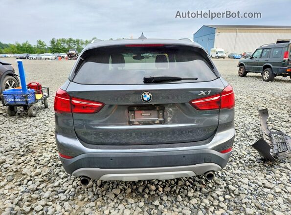 WBXHT3C30G5E50798 2016 BMW X1 Gray Rear view