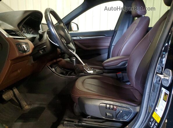 WBXHT3C31GP883886 2016 BMW X1 Black Front interior view