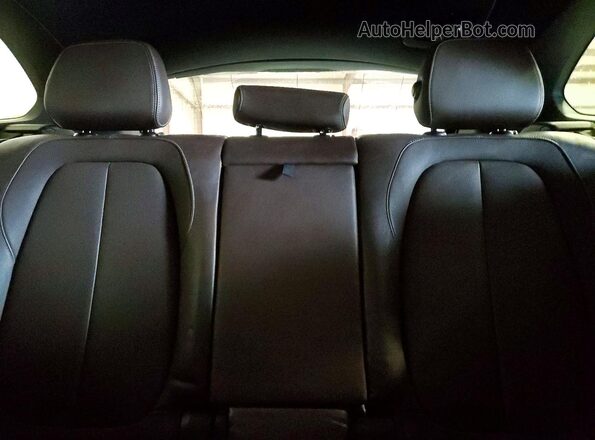 WBXHT3C31GP883886 2016 BMW X1 Black Rear seats view