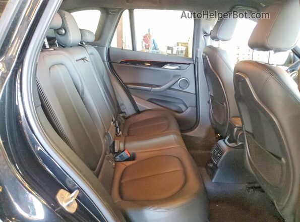 WBXHT3C31GP884035 2016 BMW X1 Black Սալոնի հետևի տեսք