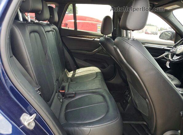 WBXHT3C31H5F86620 2017 BMW X1 Blue Սալոնի հետևի տեսք