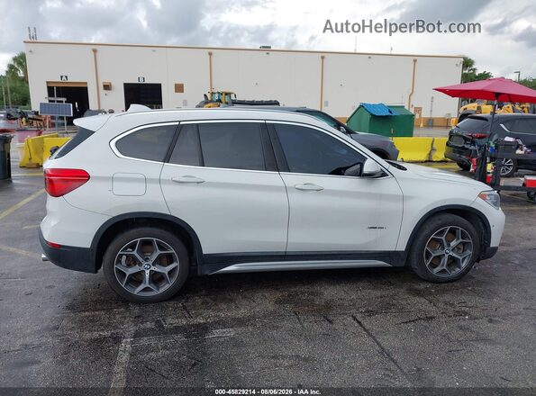 WBXHT3C31J5K25147 2018 BMW X1 White Սալոնի հետևի տեսք