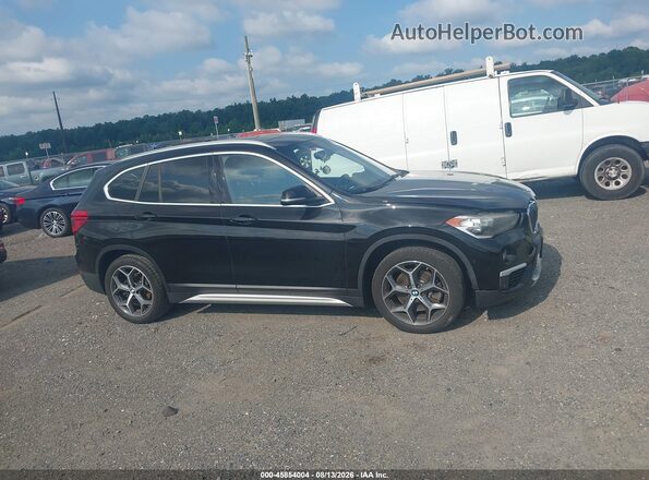 WBXHT3C31J5L29959 2018 BMW X1 Black უკანა სალონის ხედი