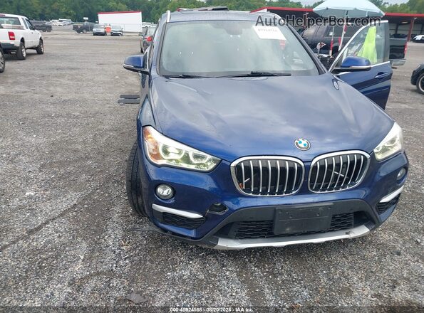 WBXHT3C32G5F65788 2016 BMW X1 Blue Front view