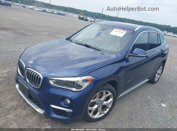 WBXHT3C32G5F65788 2016 BMW X1 Blue Front left