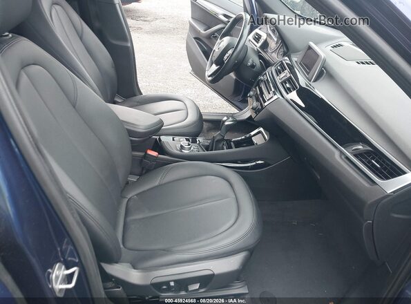 WBXHT3C32G5F65788 2016 BMW X1 Blue Front interior view
