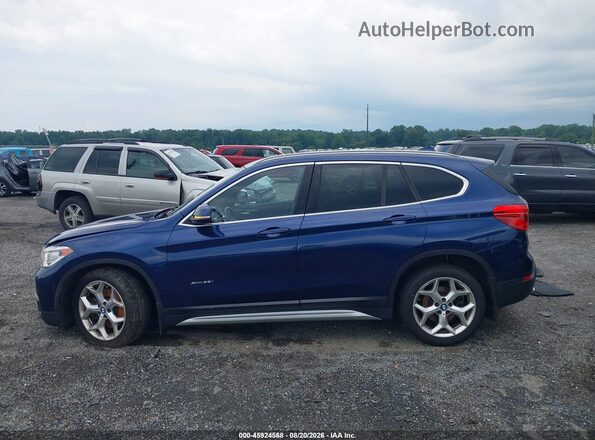 WBXHT3C32G5F65788 2016 BMW X1 Blue Rear interior view