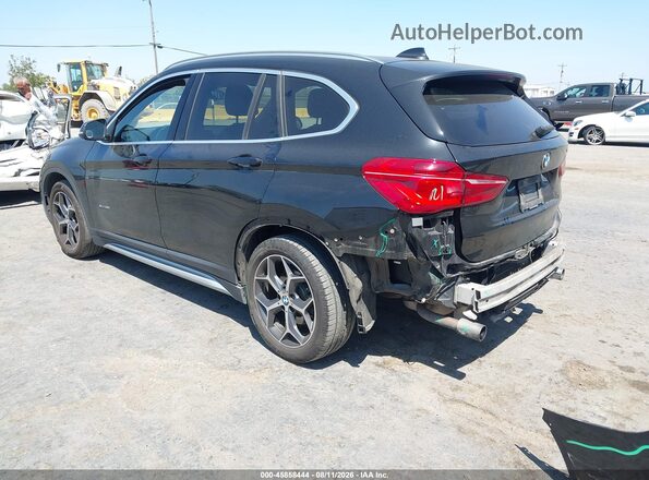 WBXHT3C32H5F68031 2017 BMW X1 Black Trasero izquierdo
