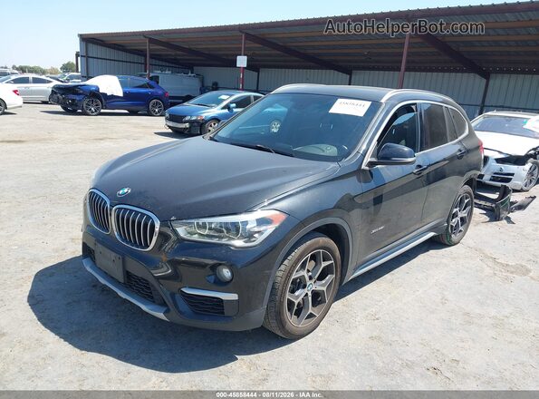 WBXHT3C32H5F68031 2017 BMW X1 Black Vista tres cuartos delantera izquierda
