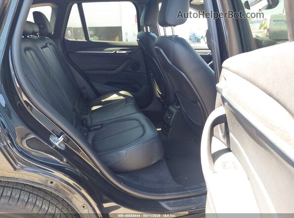 WBXHT3C32H5F68031 2017 BMW X1 Black Vista de la etiqueta del VIN