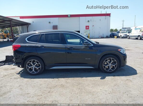 WBXHT3C32H5F68031 2017 BMW X1 Black Vista interior de 360 grados
