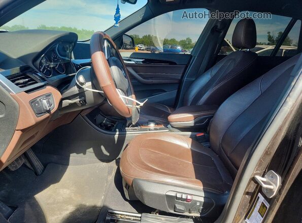 WBXHT3C32H5F70751 2017 BMW X1 Brown Front interior view