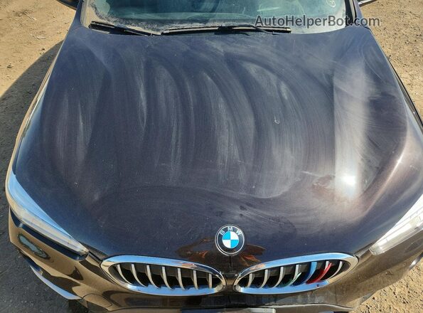WBXHT3C32H5F70751 2017 BMW X1 Brown Engine compartment view