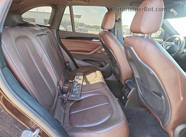 WBXHT3C32H5F70751 2017 BMW X1 Brown Rear interior view