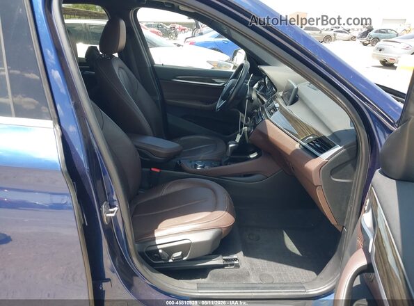 WBXHT3C32H5F77912 2017 BMW X1 Dark Blue Вид салону спереду