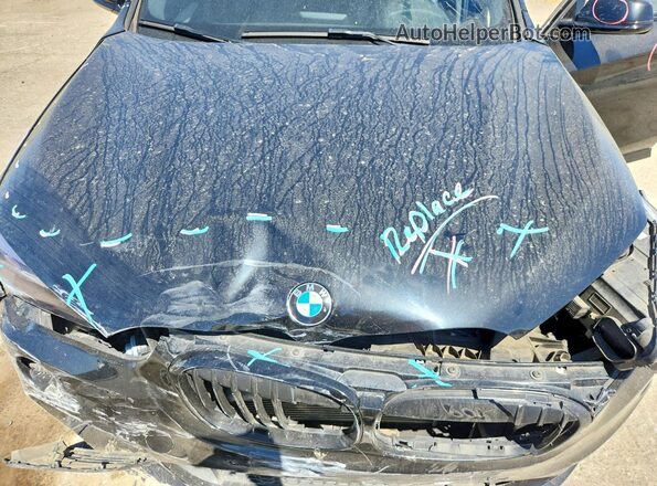 WBXHT3C33J5L28814 2018 BMW X1 Black Vista interior trasera