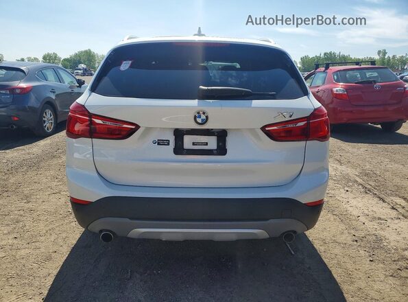 WBXHT3C34J5F91283 2018 BMW X1 White Rear view