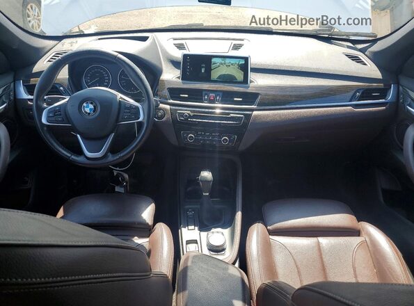 WBXHT3C34J5F91283 2018 BMW X1 White Dashboard view