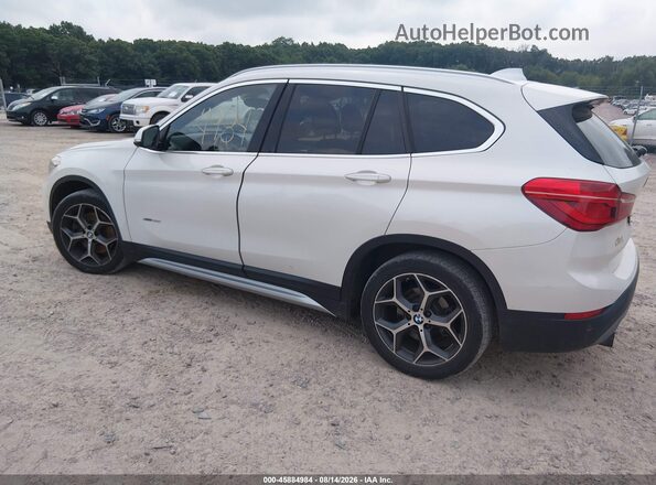 WBXHT3C35G5E48089 2016 BMW X1 White Rear left