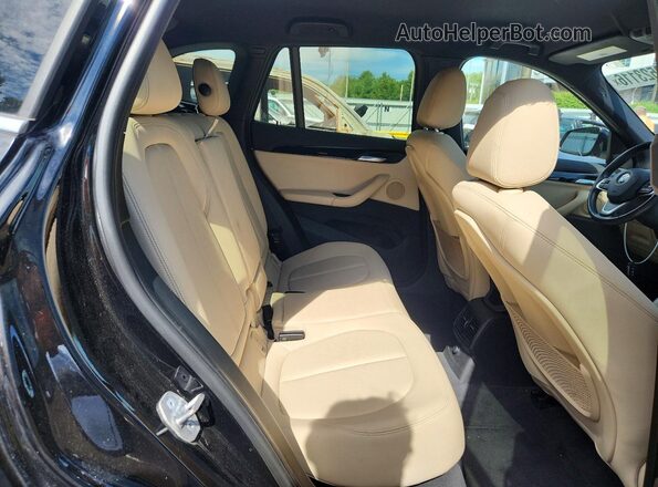 WBXHT3C35GP886418 2016 BMW X1 Black Սալոնի հետևի տեսք