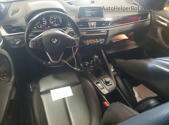 WBXHT3C35J5L28104 2018 BMW X1 Silver Dashboard view