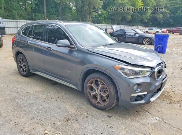 WBXHT3C36G5E48134 2016 BMW X1 Gray Front right